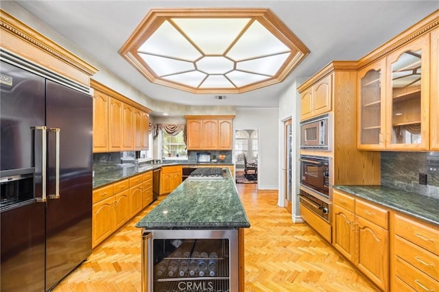 8905 Saint Cloud Ln, Bakersfield, CA 93311 - kitchen with beverage cooler, built in appliances, glass insert cabinets, and tasteful backsplash