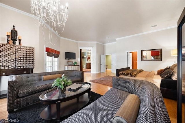 8905 Saint Cloud Ln, Bakersfield, CA 93311 - living area featuring wood finished floors, a chandelier, and crown molding