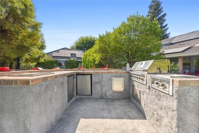 8905 Saint Cloud Ln, Bakersfield, CA 93311 - view of patio featuring exterior kitchen