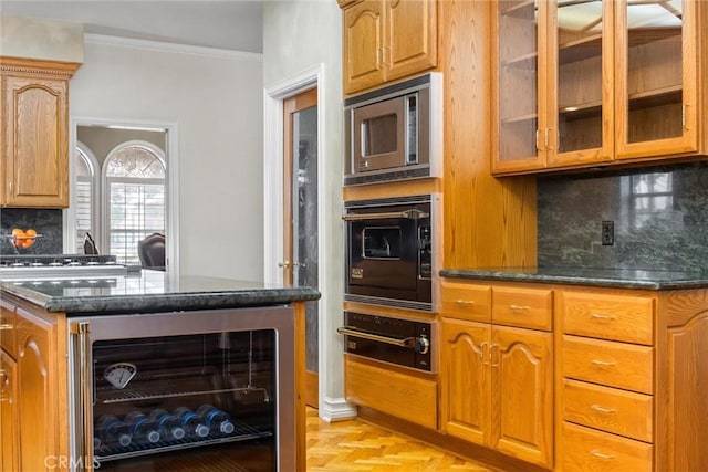 8905 Saint Cloud Ln, Bakersfield, CA 93311 - kitchen with beverage cooler, a warming drawer, dark stone counters, glass insert cabinets, and crown molding