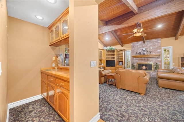 8905 Saint Cloud Ln, Bakersfield, CA 93311 - living room with a ceiling fan, dark carpet, wood ceiling, a fireplace, and recessed lighting