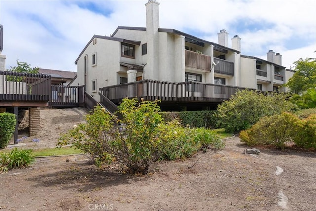 1330 W Apricot Ave, Lompoc, CA 93436 - rear view of property with stucco siding and a chimney