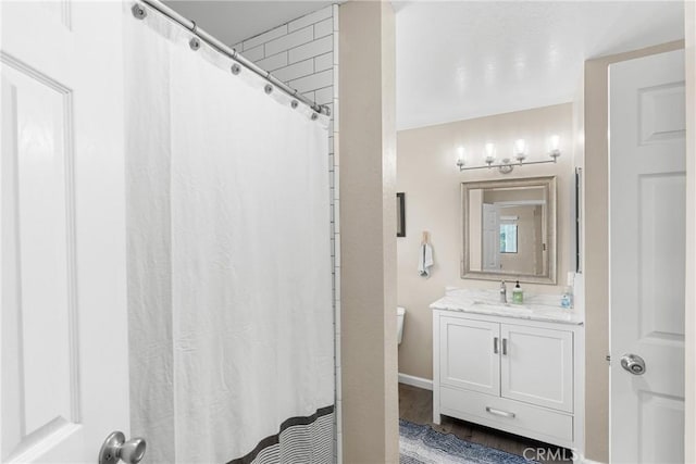 1330 W Apricot Ave, Lompoc, CA 93436 - full bathroom with vanity, wood finished floors, and curtained shower