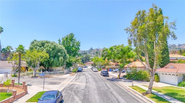 15339 Regalado St, Hacienda Heights, CA 91745 - view of asphalt road with sidewalks and curbs