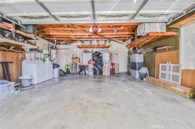 15339 Regalado St, Hacienda Heights, CA 91745 - garage with washing machine and clothes dryer, a garage door opener, and wood walls