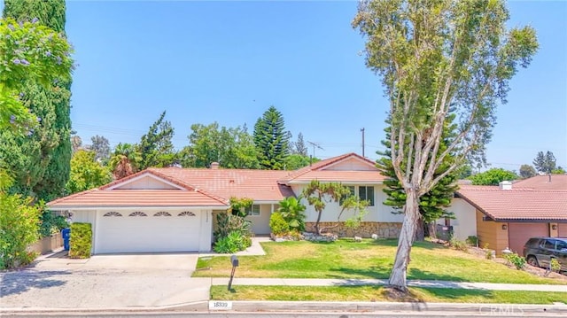 15339 Regalado St, Hacienda Heights, CA 91745 - ranch-style house with a garage, concrete driveway, a front yard, a tile roof, and stucco siding
