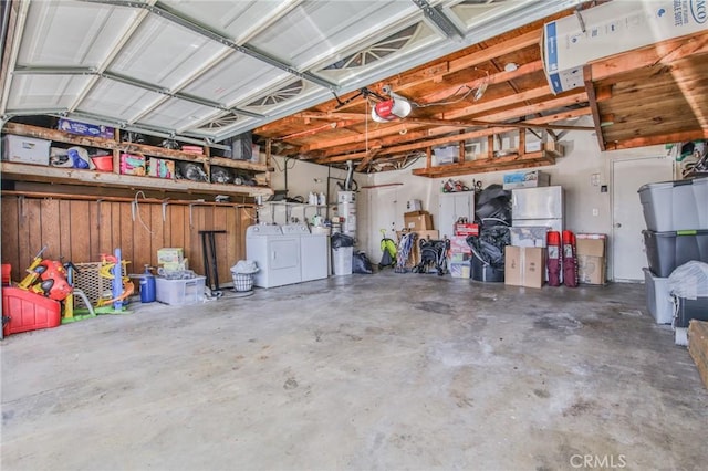 15339 Regalado St, Hacienda Heights, CA 91745 - garage featuring independent washer and dryer, strapped water heater, and a garage door opener
