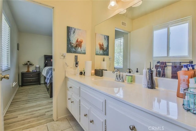 15339 Regalado St, Hacienda Heights, CA 91745 - bathroom featuring vanity, healthy amount of natural light, connected bathroom, and tile patterned flooring