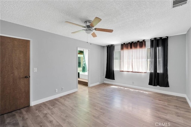 26453 Buccaneer Ln, Helendale, CA 92342 - unfurnished room featuring a ceiling fan, a textured ceiling, and wood finished floors