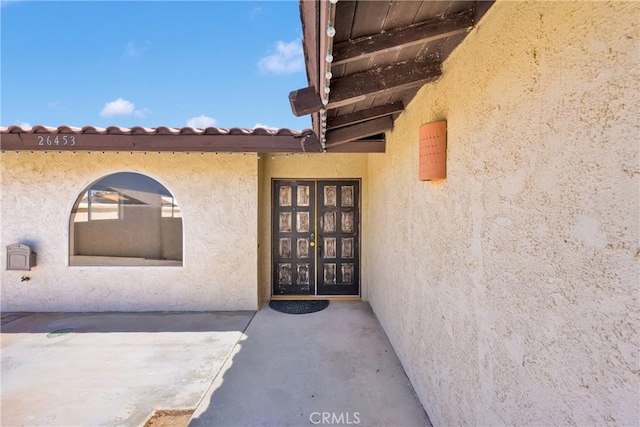 26453 Buccaneer Ln, Helendale, CA 92342 - view of exterior entry with stucco siding