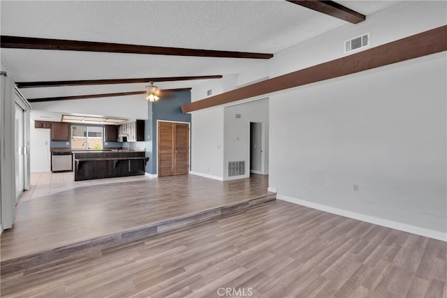 26453 Buccaneer Ln, Helendale, CA 92342 - unfurnished living room with a textured ceiling, light wood-style floors, and ceiling fan
