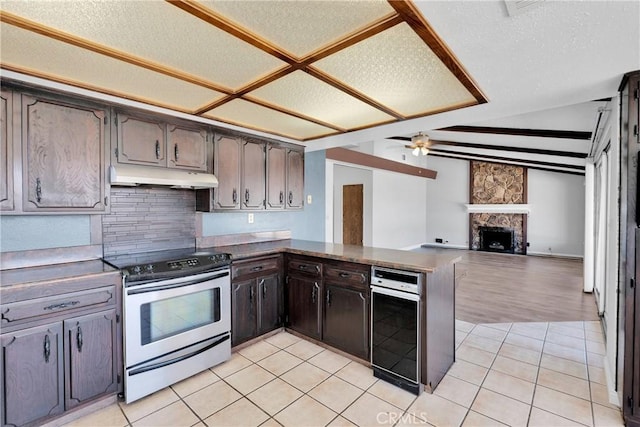 26453 Buccaneer Ln, Helendale, CA 92342 - kitchen featuring electric range, backsplash, ceiling fan, open floor plan, and a peninsula