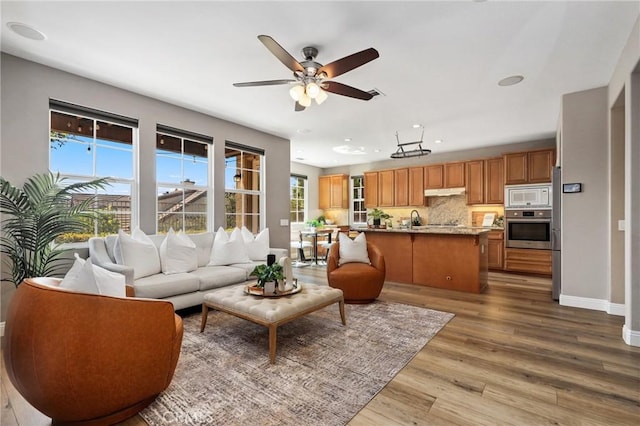 7 Sachem Way, Ladera Ranch, CA 92694 - living area with wood finished floors, a ceiling fan, and recessed lighting