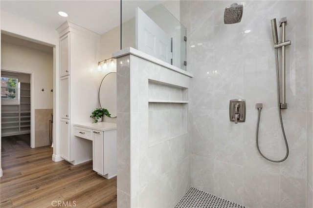 7 Sachem Way, Ladera Ranch, CA 92694 - full bathroom with walk in shower, wood finished floors, vanity, and a walk in closet