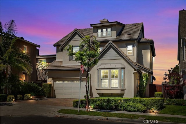 7 Sachem Way, Ladera Ranch, CA 92694 - traditional home with an attached garage, driveway, stucco siding, and a tile roof