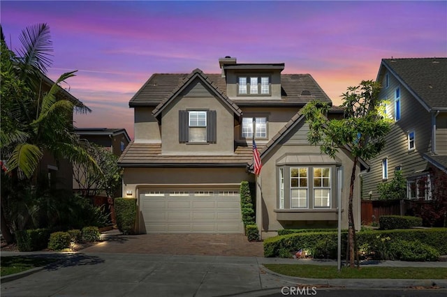 7 Sachem Way, Ladera Ranch, CA 92694 - traditional-style home featuring stucco siding, driveway, a garage, a chimney, and a tiled roof