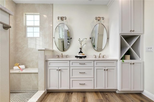 7 Sachem Way, Ladera Ranch, CA 92694 - bathroom with double vanity, walk in shower, and wood finished floors
