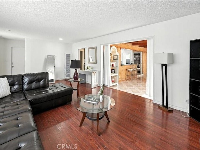 20319 Vanowen St, Winnetka, CA 91306 - living area with wood finished floors and a textured ceiling