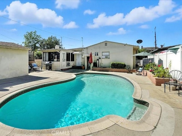 20319 Vanowen St, Winnetka, CA 91306 - outdoor pool with a patio area, a grill, and a sunroom