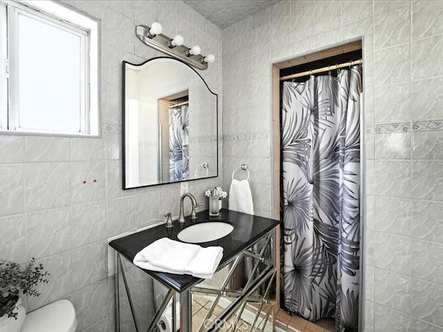 20319 Vanowen St, Winnetka, CA 91306 - full bath featuring tile walls, curtained shower, and vanity