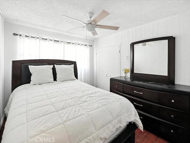 20319 Vanowen St, Winnetka, CA 91306 - bedroom with a textured ceiling, dark wood-type flooring, and a ceiling fan