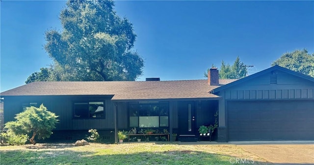 9 Montclair Dr, Chico, CA 95926 - single story home featuring board and batten siding, a front yard, an attached garage, driveway, and a shingled roof