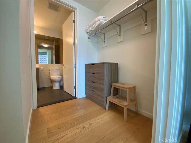 889 Francisco St Unit 1105, Los Angeles, CA 90017 - walk in closet featuring light wood-style floors