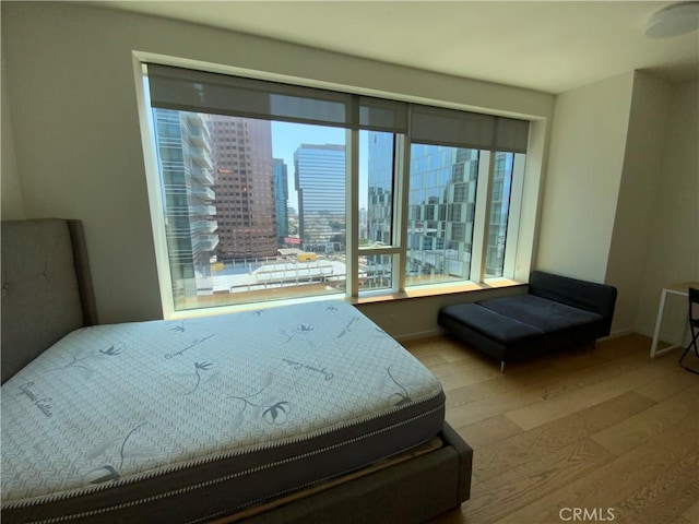 889 Francisco St Unit 1105, Los Angeles, CA 90017 - bedroom featuring wood finished floors and a view of city