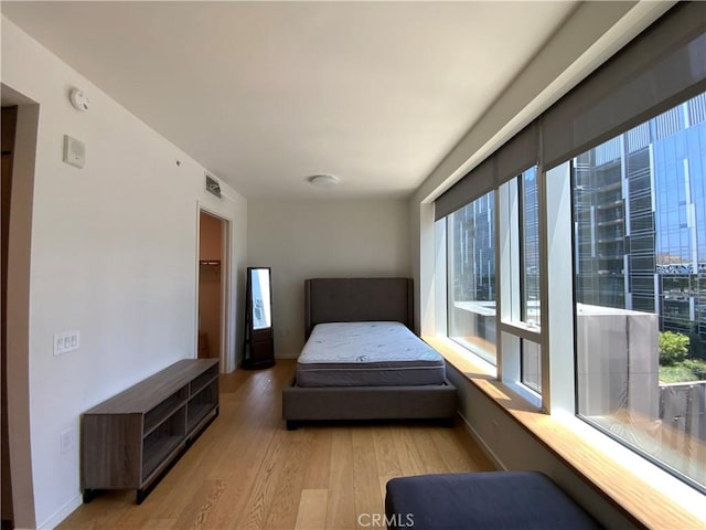 889 Francisco St Unit 1105, Los Angeles, CA 90017 - bedroom with light wood-style floors and baseboards