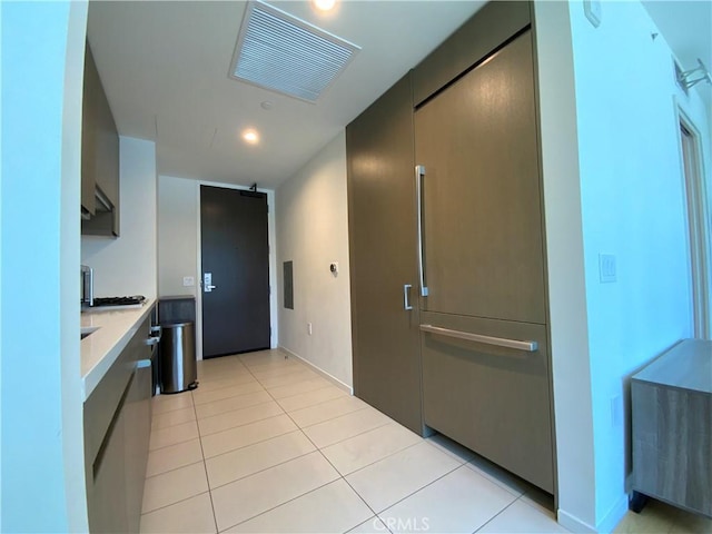 889 Francisco St Unit 1105, Los Angeles, CA 90017 - kitchen featuring light countertops, light tile patterned floors, and recessed lighting