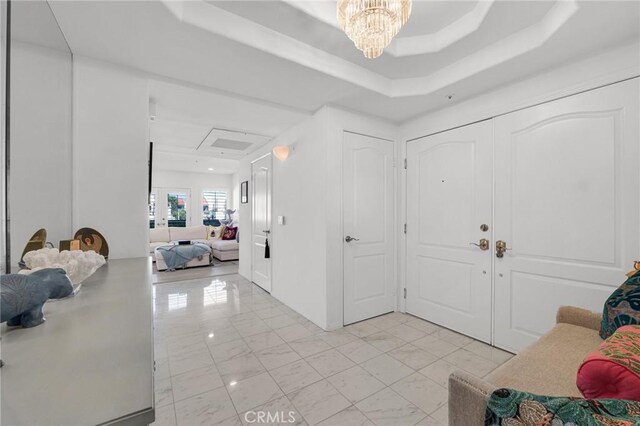 5224 Zelzah Ave Unit 208, Encino, CA 91316 - entrance foyer with a tray ceiling and a chandelier