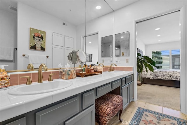 5224 Zelzah Ave Unit 208, Encino, CA 91316 - ensuite bathroom with double vanity, tile patterned flooring, and recessed lighting
