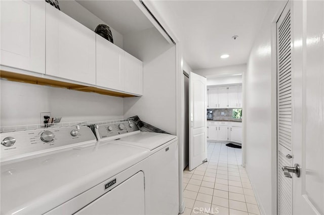 5224 Zelzah Ave Unit 208, Encino, CA 91316 - washroom with cabinet space, light tile patterned floors, and independent washer and dryer