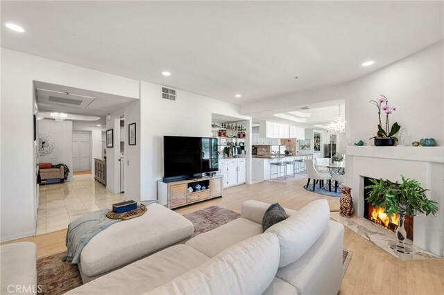5224 Zelzah Ave Unit 208, Encino, CA 91316 - living room featuring recessed lighting and light wood finished floors