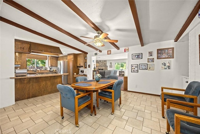 2912 Fragancia Ave, Hacienda Heights, CA 91745 - dining room with ceiling fan, healthy amount of natural light, and beam ceiling