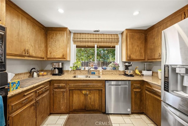 2912 Fragancia Ave, Hacienda Heights, CA 91745 - kitchen with stainless steel appliances, light tile patterned floors, brown cabinetry, and recessed lighting