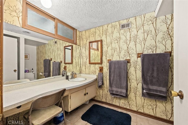 2912 Fragancia Ave, Hacienda Heights, CA 91745 - bathroom featuring wallpapered walls, vanity, a textured ceiling, and tile patterned floors