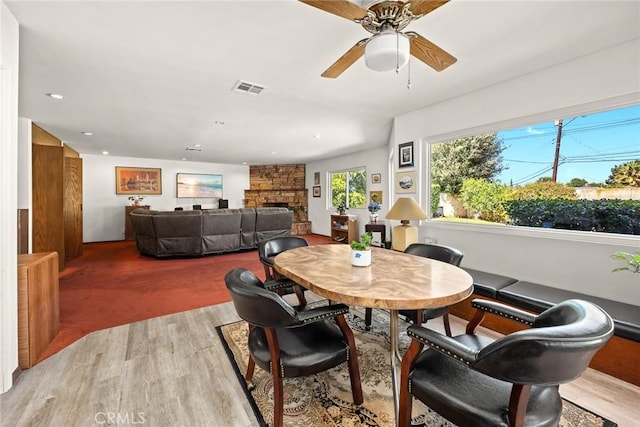 2912 Fragancia Ave, Hacienda Heights, CA 91745 - dining area with light wood-style floors, a ceiling fan, a stone fireplace, and recessed lighting
