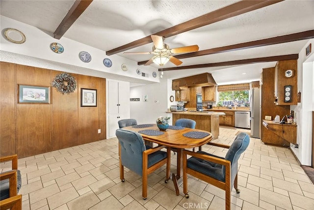 2912 Fragancia Ave, Hacienda Heights, CA 91745 - dining space featuring ceiling fan, beamed ceiling, and wooden walls