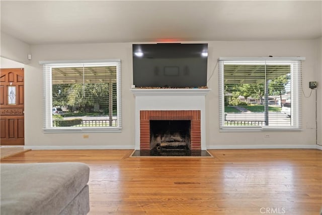 33 Miner St, Bakersfield, CA 93305 - living room featuring wood finished floors and a fireplace