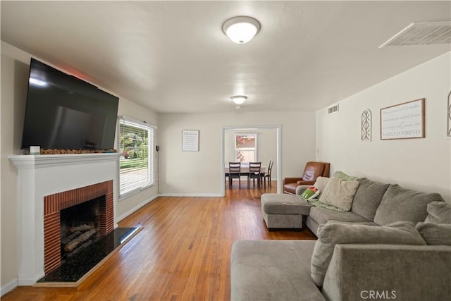 33 Miner St, Bakersfield, CA 93305 - living area with a fireplace and wood finished floors