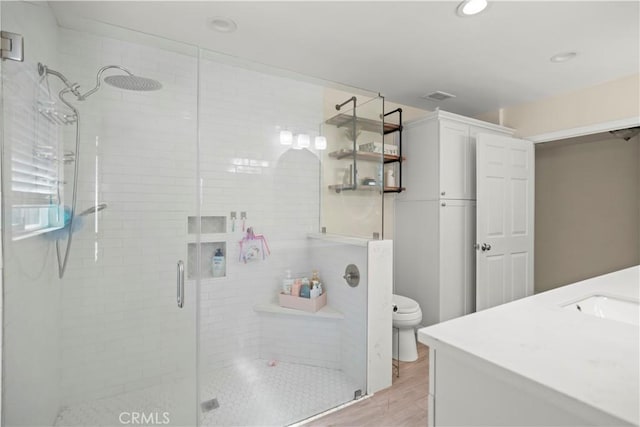 33 Miner St, Bakersfield, CA 93305 - full bath with vanity, a stall shower, wood finished floors, and recessed lighting