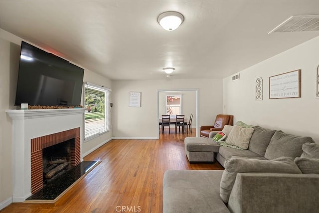 33 Miner St, Bakersfield, CA 93305 - living area featuring a fireplace and wood finished floors