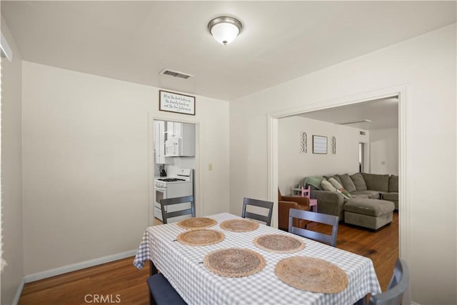33 Miner St, Bakersfield, CA 93305 - dining room with wood finished floors and baseboards