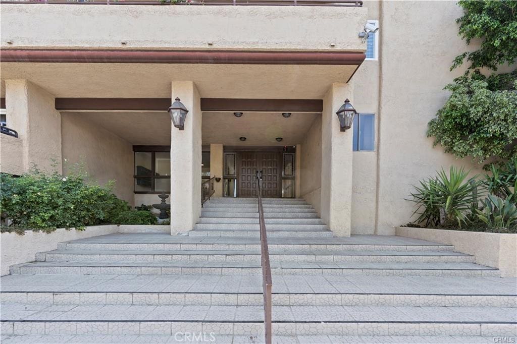 5412 Lindley Ave Unit 108, Encino, CA 91316 - doorway to property featuring stucco siding