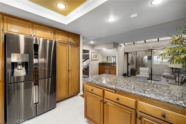 1610 Via Estrella, Pomona, CA 91768 - kitchen featuring stainless steel fridge, brown cabinetry, dark stone countertops, a textured ceiling, and recessed lighting
