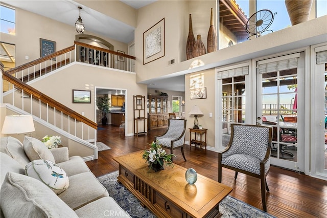 1610 Via Estrella, Pomona, CA 91768 - living area featuring stairs, hardwood / wood-style flooring, french doors, and a towering ceiling