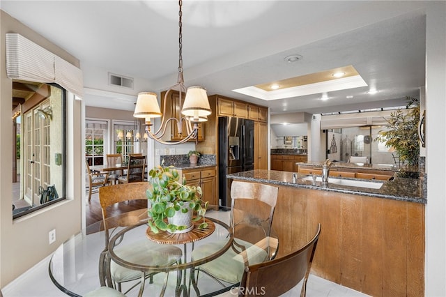 1610 Via Estrella, Pomona, CA 91768 - dining space with a chandelier, a tray ceiling, and recessed lighting