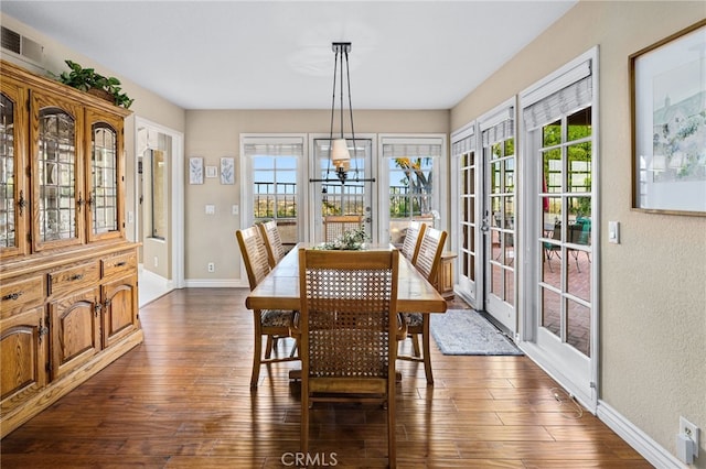 1610 Via Estrella, Pomona, CA 91768 - dining room with plenty of natural light, dark wood-type flooring, a chandelier, and a textured wall