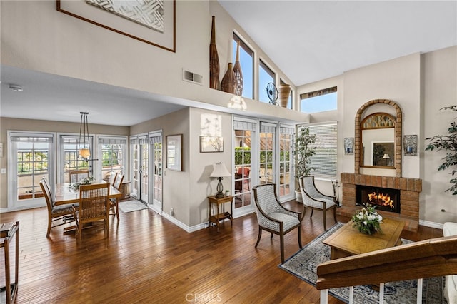 1610 Via Estrella, Pomona, CA 91768 - living room featuring hardwood / wood-style flooring, a fireplace, and a towering ceiling